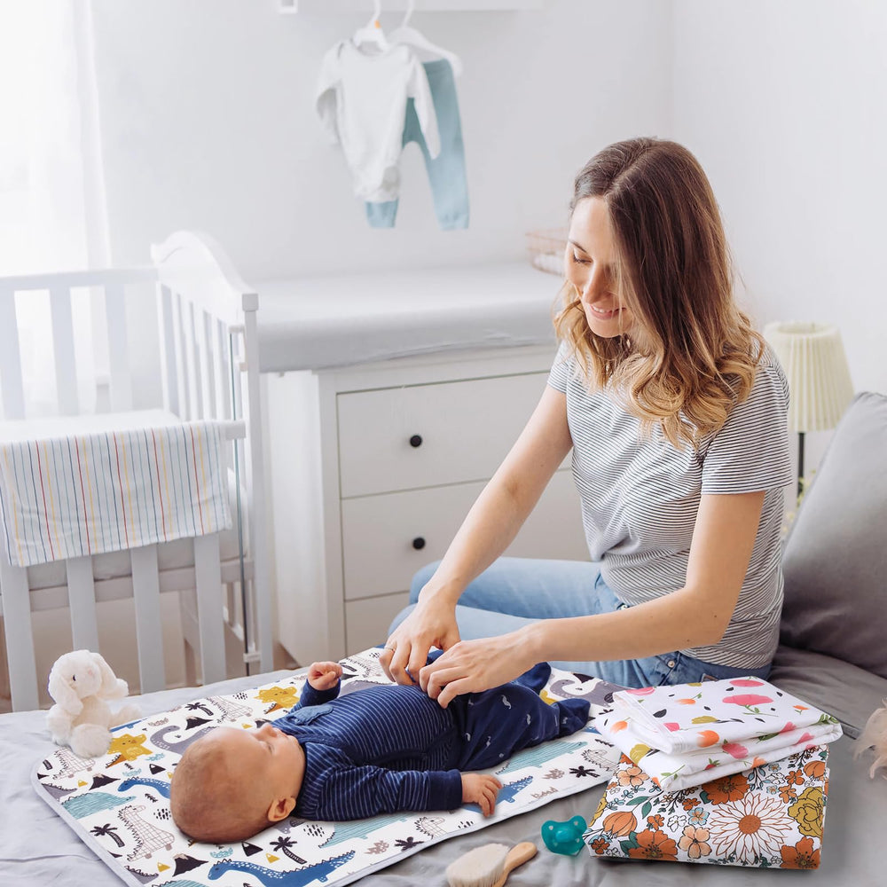Bnditeu reusable dinosaur change pad design makes a thoughtful baby shower gift.