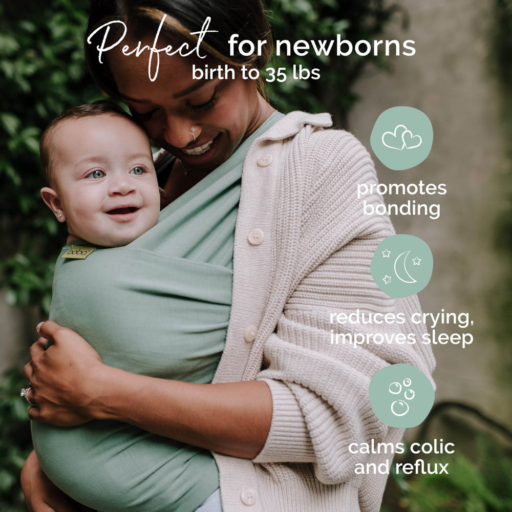 Boba sage green infant carry shows ergonomic position and snug fit.
