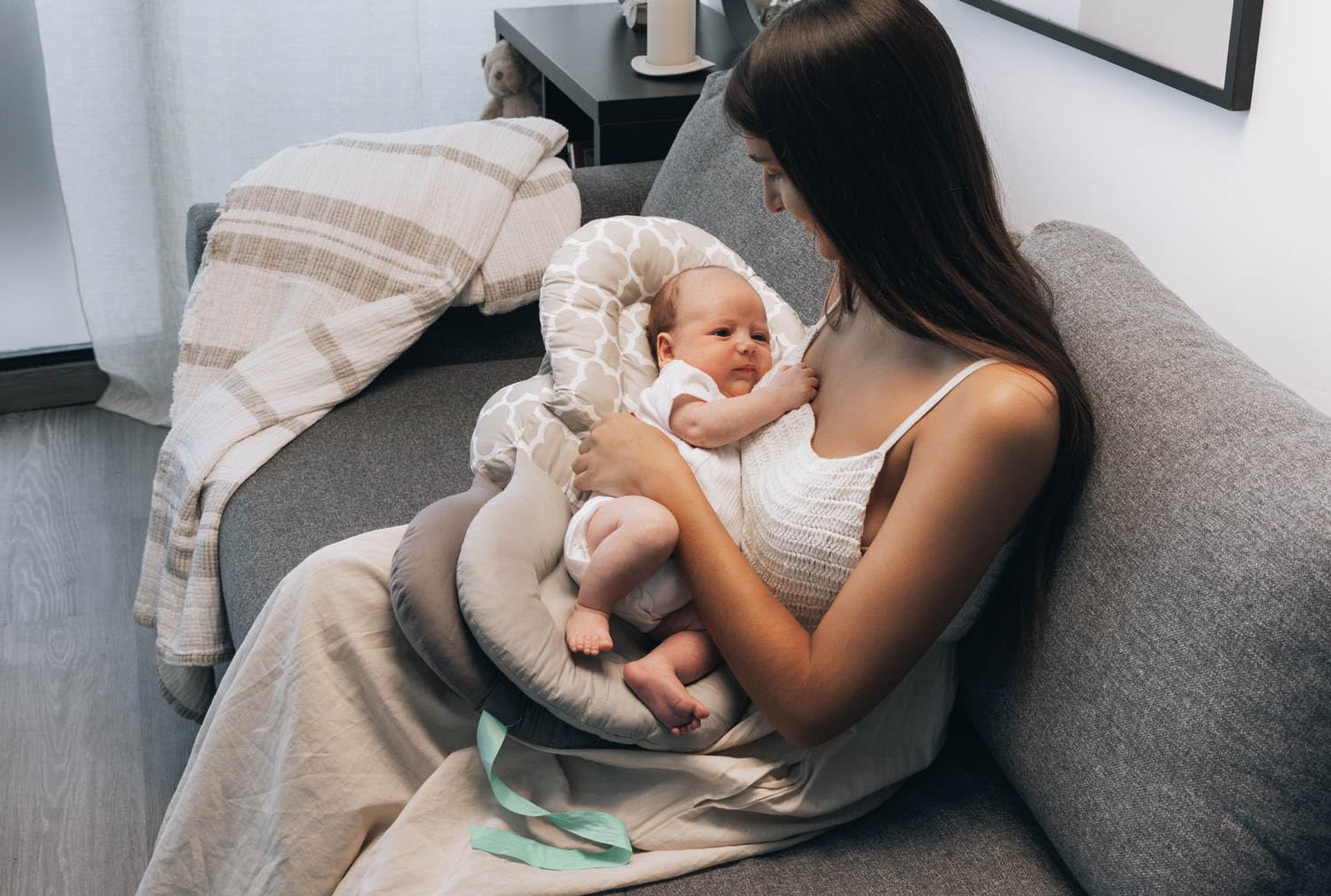 bodreamz nursing pillow aids bottle feeding positioning and comfort.