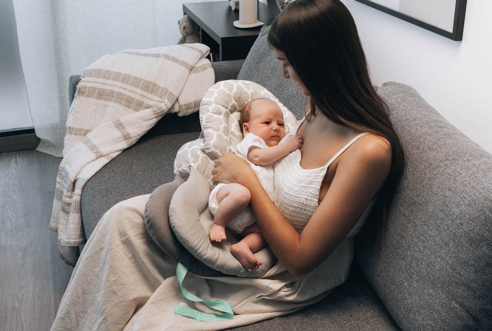 bodreamz nursing pillow aids bottle feeding positioning and comfort.