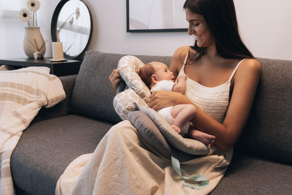 bodreamz nursing pillow supports newborns 0-5 months during feeding sessions.