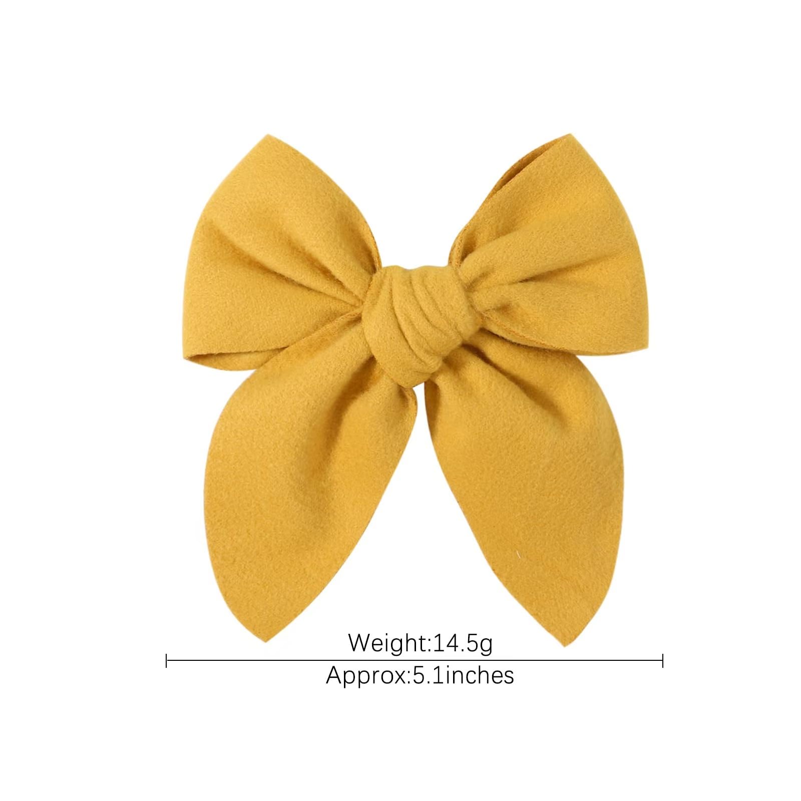 BOENBE LOVED linen-texture yellow bow clip close-up highlighting soft fabric.