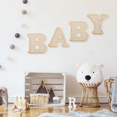 Boho rattan baby letters as newborn gift with rustic charm.
