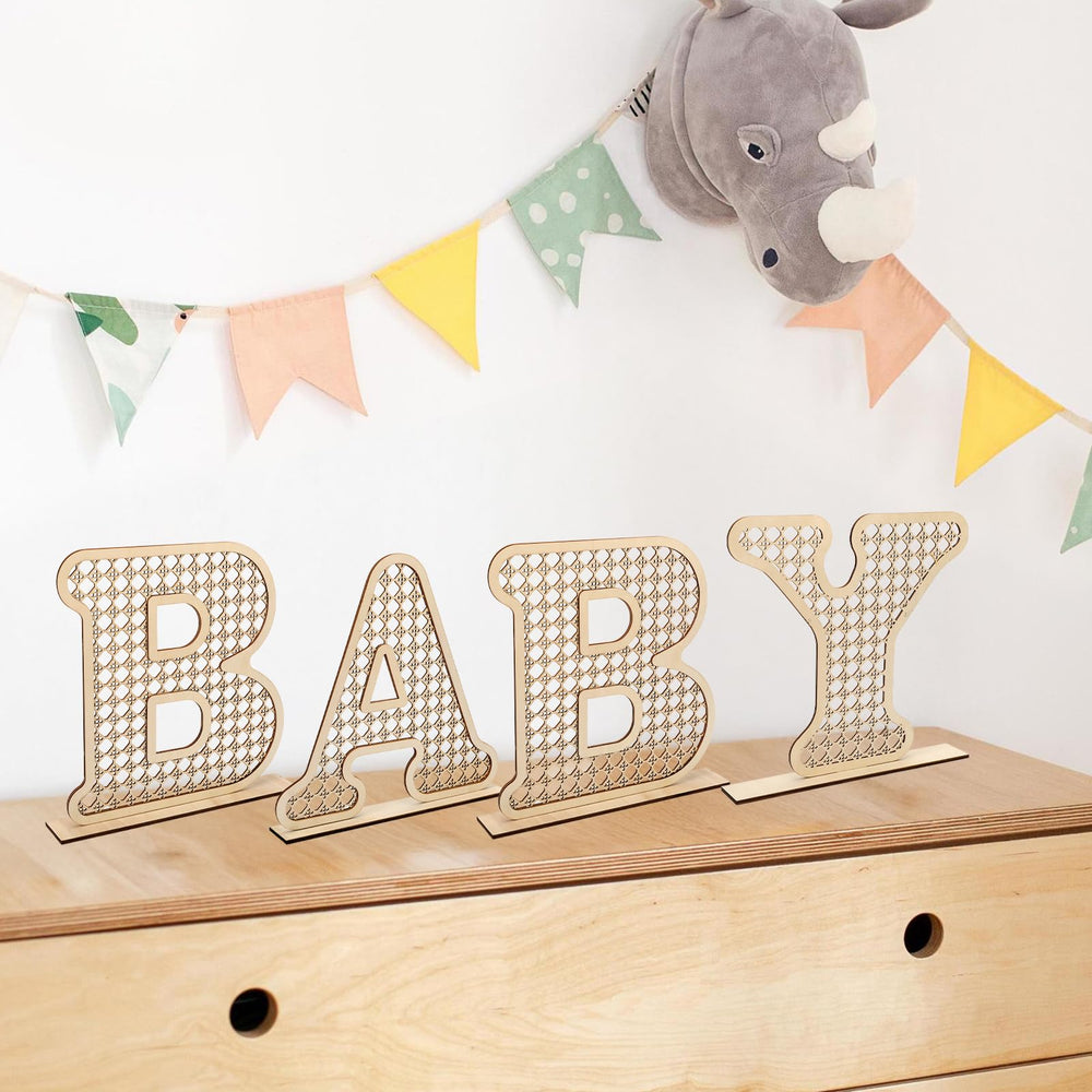 Boho rattan baby letters used in nursery decor for cozy bohemian vibe.
