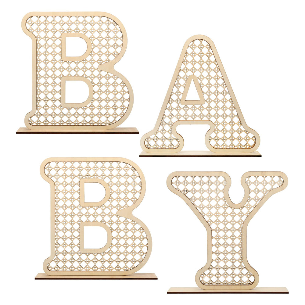 Boho rattan baby letters on table centerpiece for charming nursery decor.