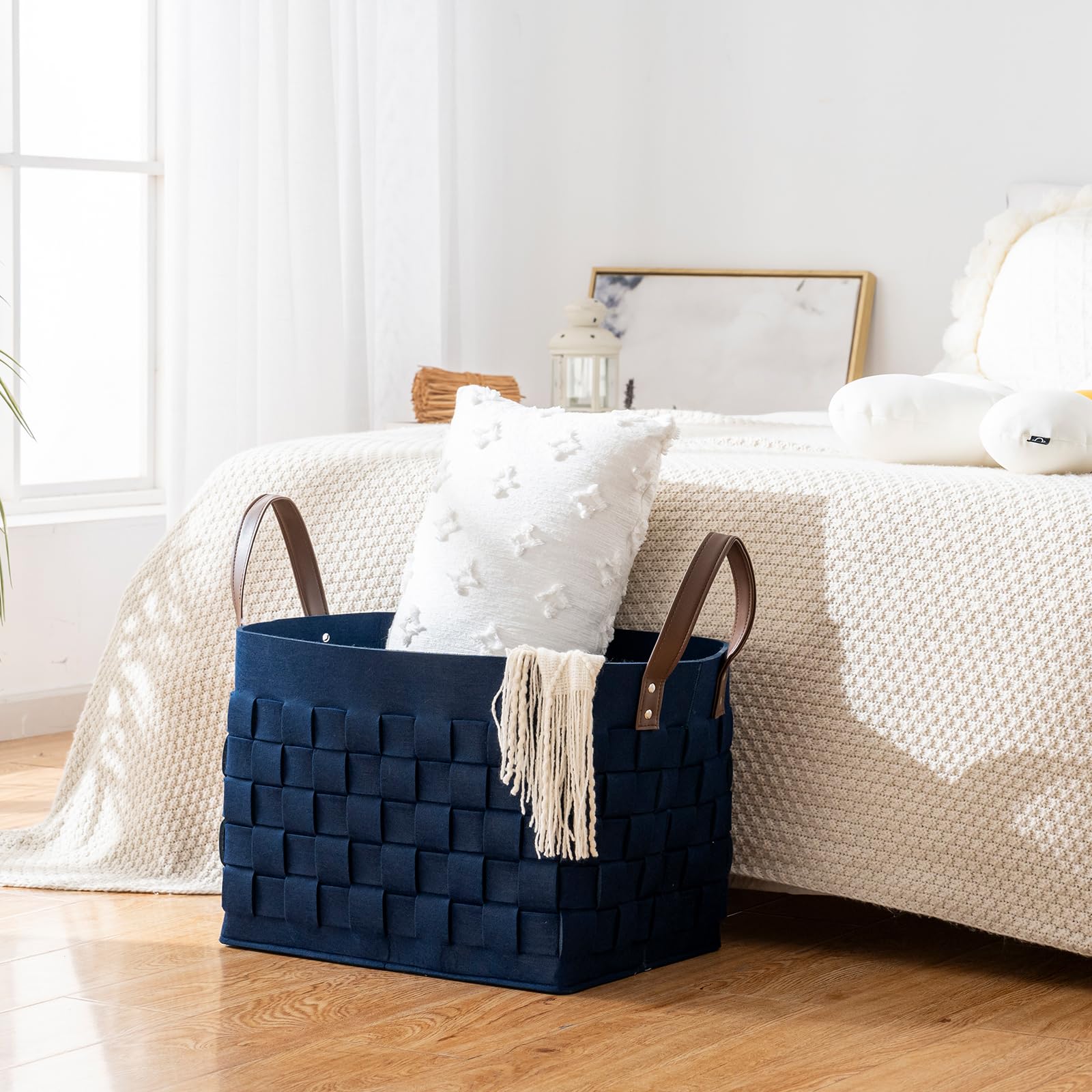 boldmonkey blankets basket navy nursery setup for toy storage and tidy play area.