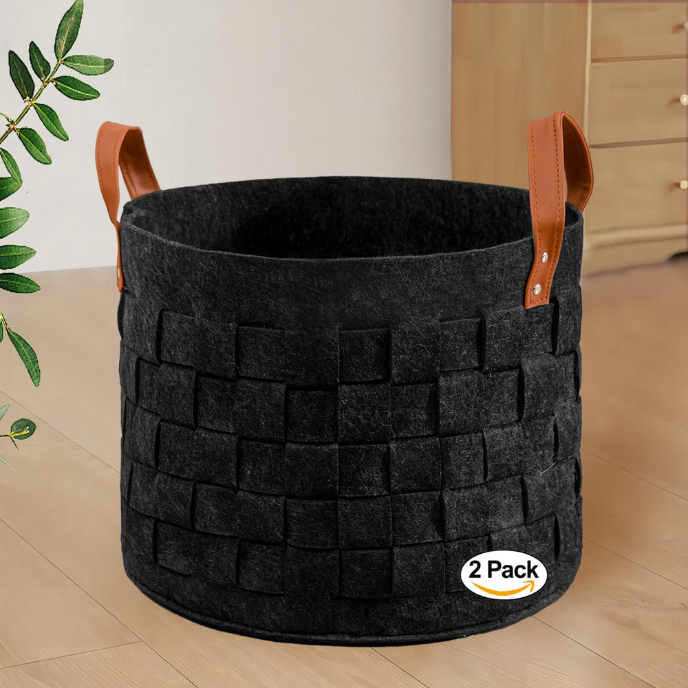 Boldmonkey laundry-basket-round-01 with leather handles for easy transport and organized blankets.