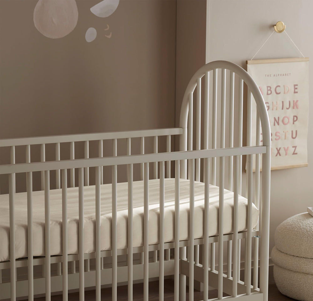 Boll & Branch Signature crib sheet machine-wash-friendly design simplifies laundry routines.