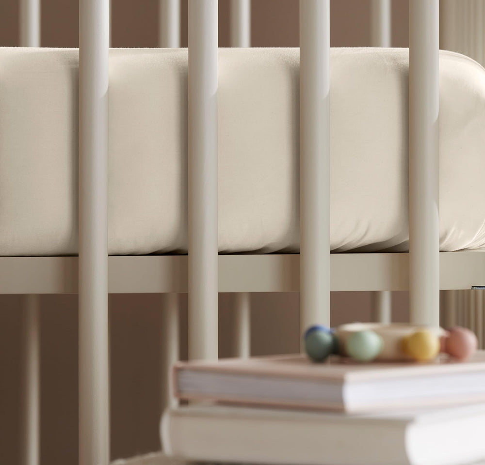 Boll & Branch Signature crib sheet natural color closeup conveys gentle baby-friendly touch.