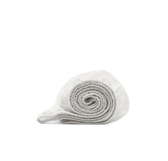 Boll & Branch Signature crib sheet white close-up shows softness for baby sleep.