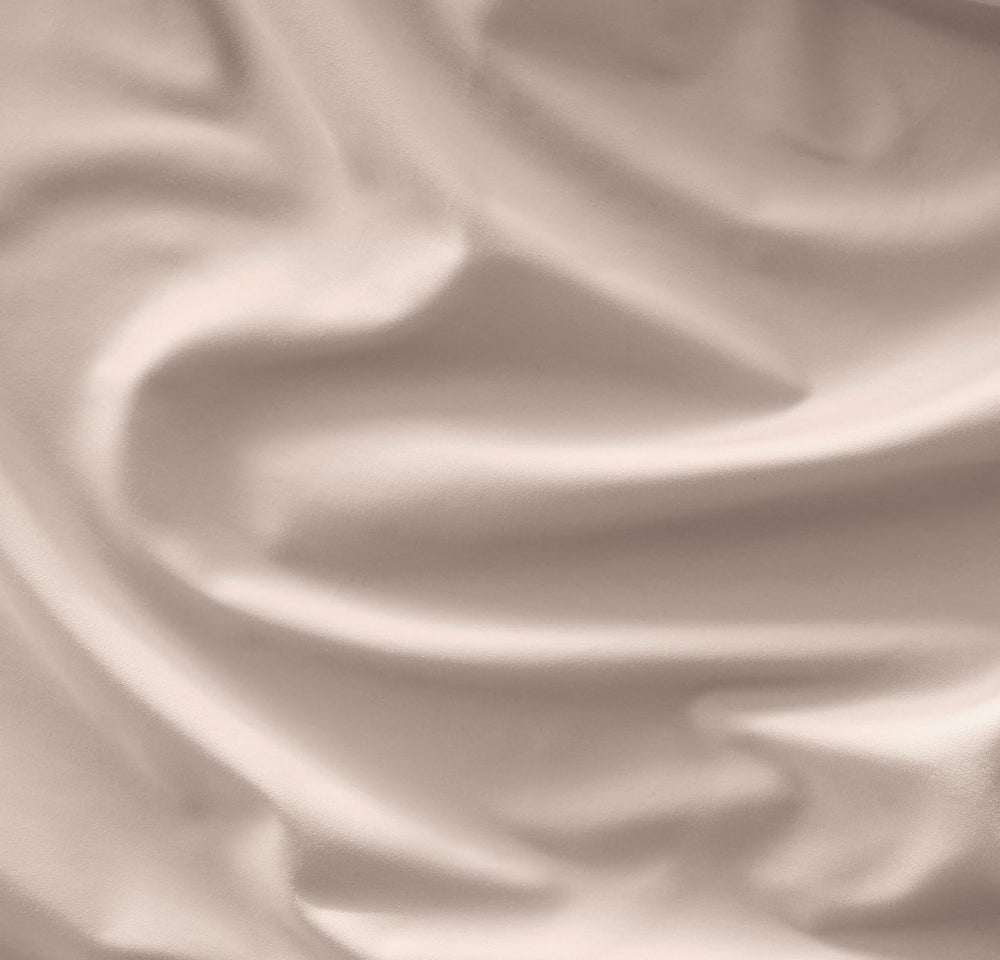 Boll & Branch Signature Hemmed Crib Sheet on mattress; secure fit with topstitched elastic for peaceful nights.