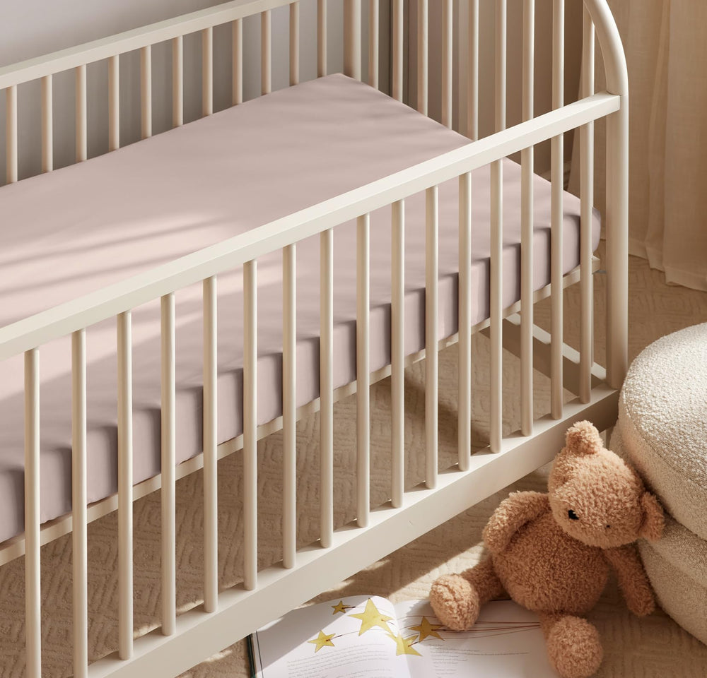 Boll & Branch Signature Hemmed Crib Sheet – close-up fabric shows breathable, toxin-free organic cotton texture.