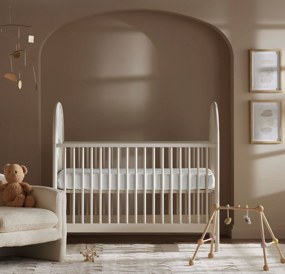 Boll & Branch Signature Crib Sheet Mist on mattress delivers snug, safe sleep surface