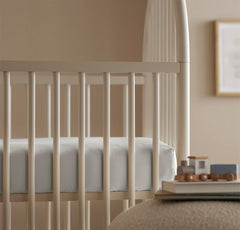 Boll & Branch Mist crib sheet after wash stays soft and durable