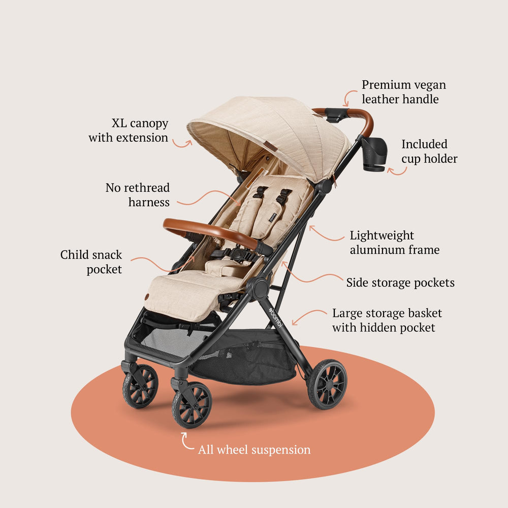 Bombi Bēbee V2 sand airtag-pocket-cup-holder illustrates travel-ready convenience
