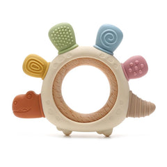 Boobaby dinosaur teether close-up showing textured silicone for gum soothing