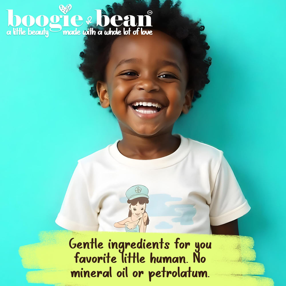 Boogie and Bean Coco Baby Hair Oil on scalp—non-greasy hydration that soothes dryness.