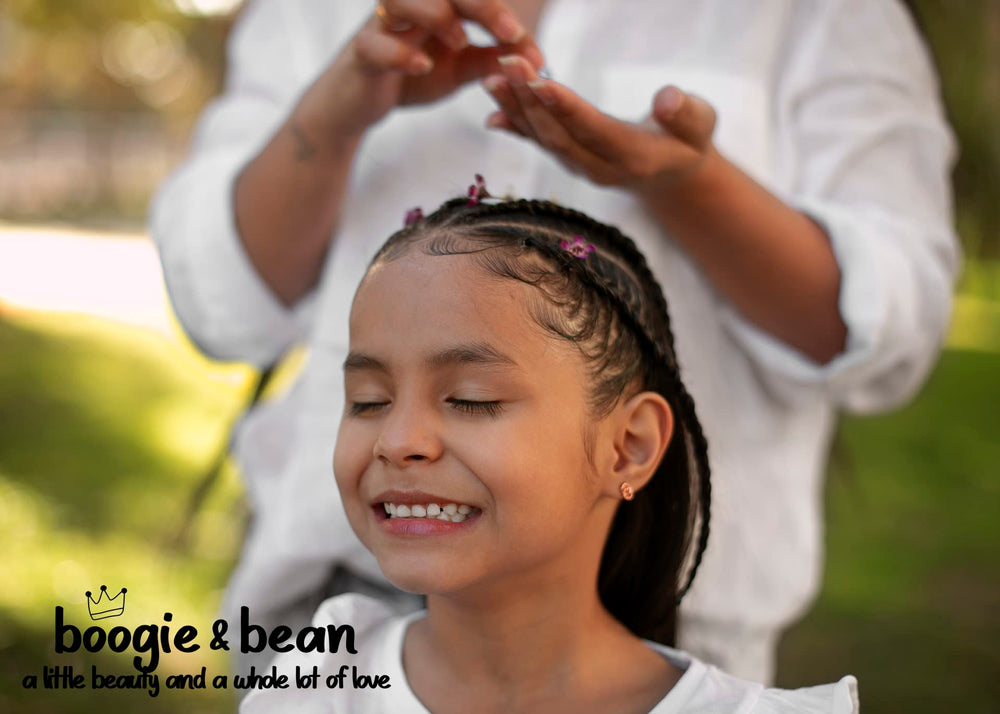 Boogie and Bean coconut oil shown for soothing baby massage.