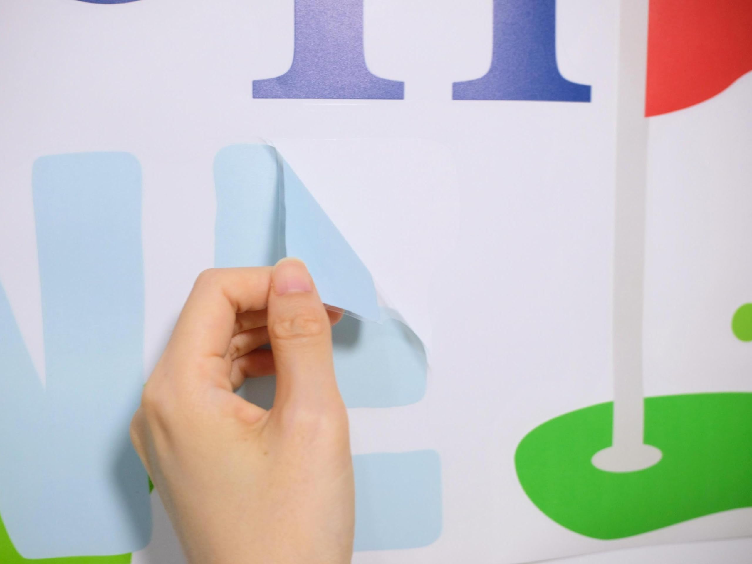 Boompa powder-blue and white graphics elevate indoor golf-themed celebrations.