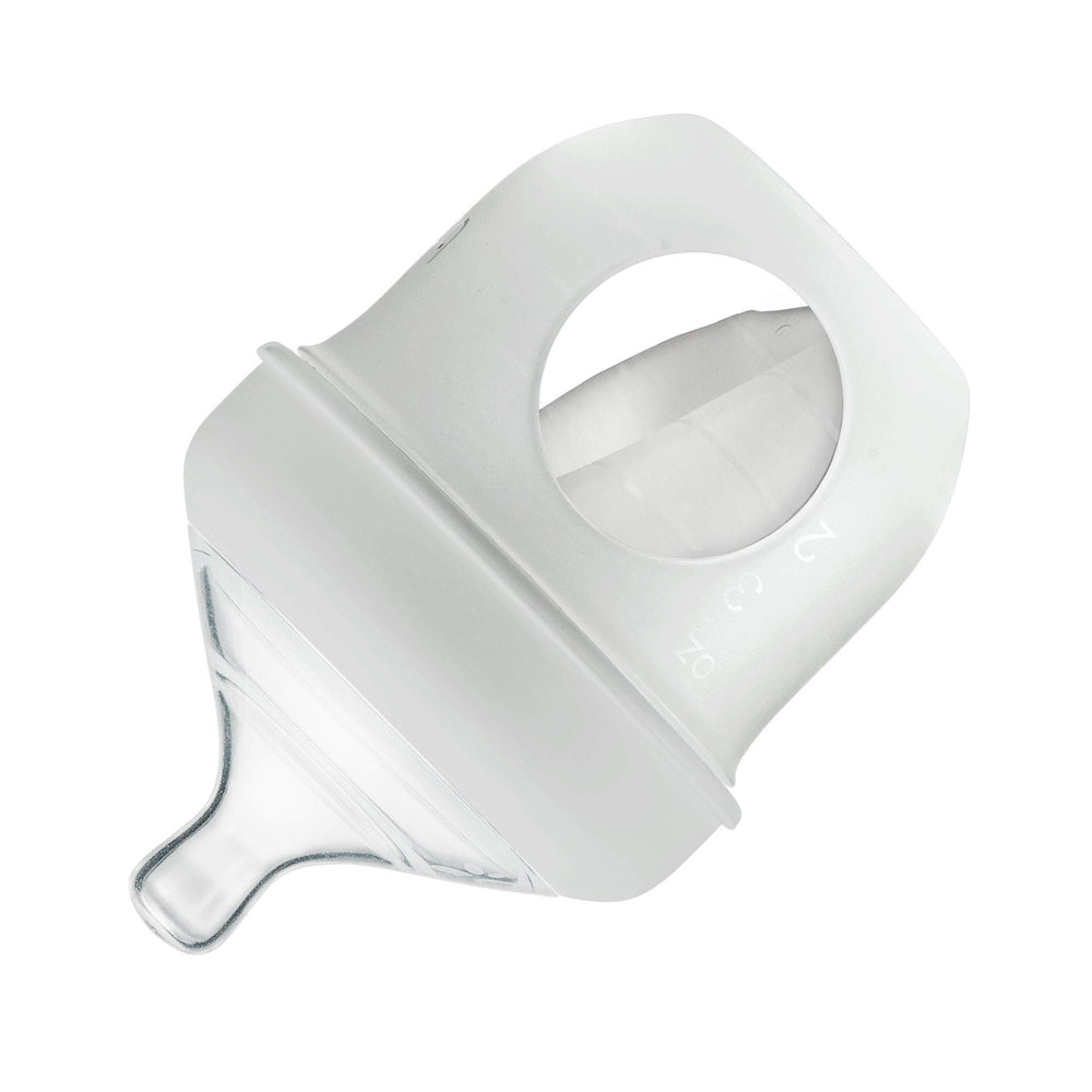 Boon Nursh silicone pouch gray collapses with feeding, reducing air exposure.