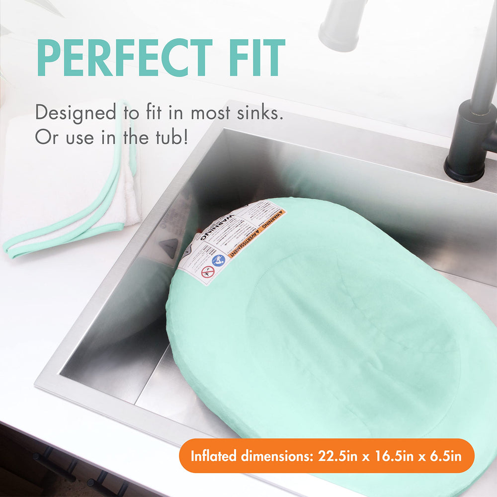 Boon Puff contoured sides cradle tiny swimmers for secure bath sessions