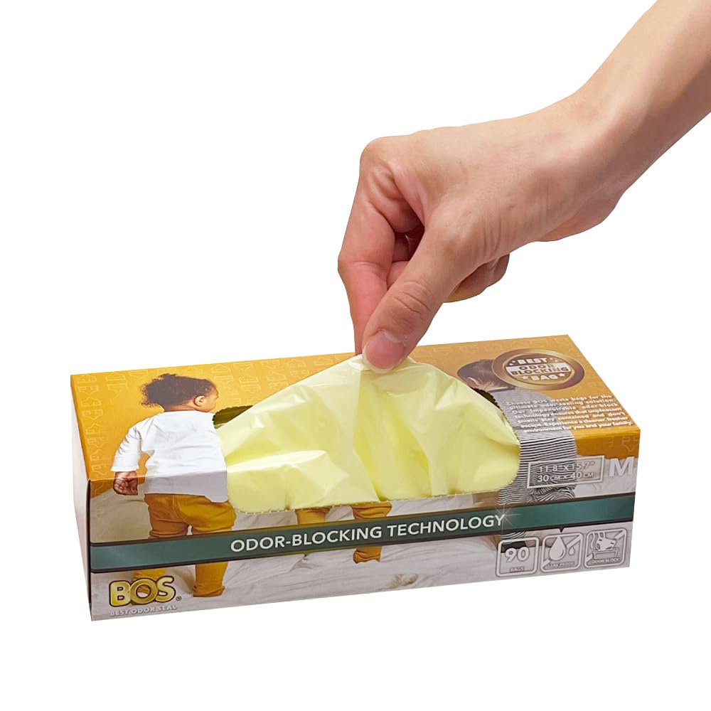 BOS cream-yellow diaper bags shown at a diaper pail to emphasize odor containment.