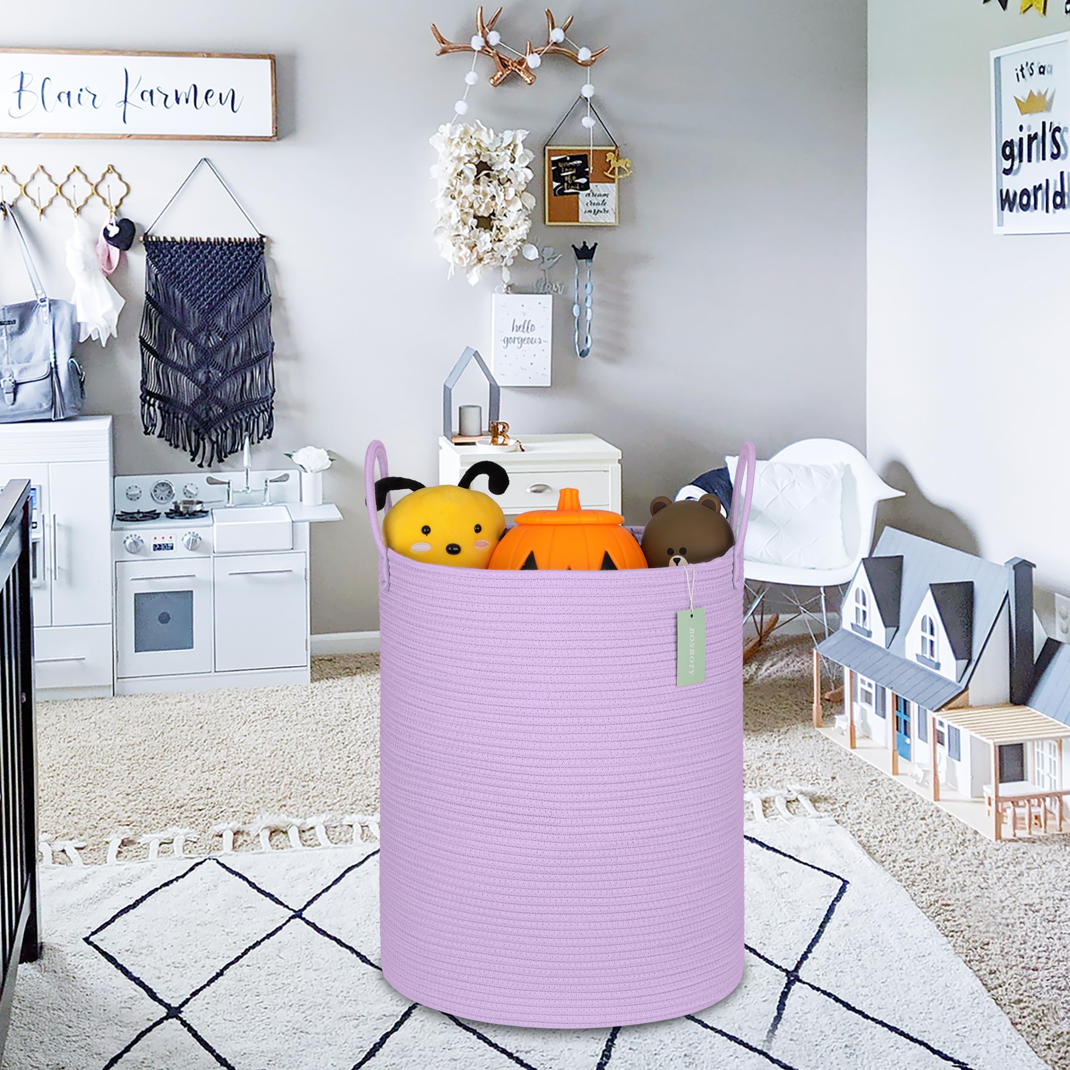 BOSROTY nursery basket in a baby room for organizing clothes and blankets.