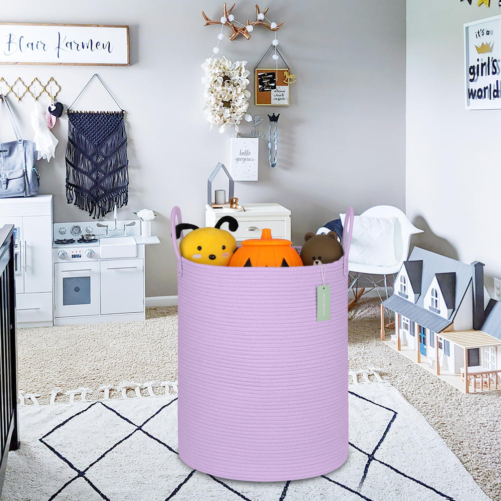 BOSROTY nursery basket in a baby room for organizing clothes and blankets.