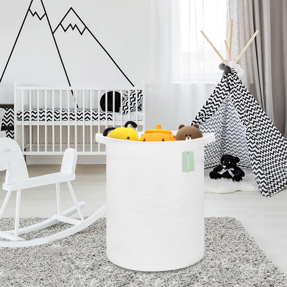 Multi-purpose BOSROTY basket used as blanket bin and toy organizer.