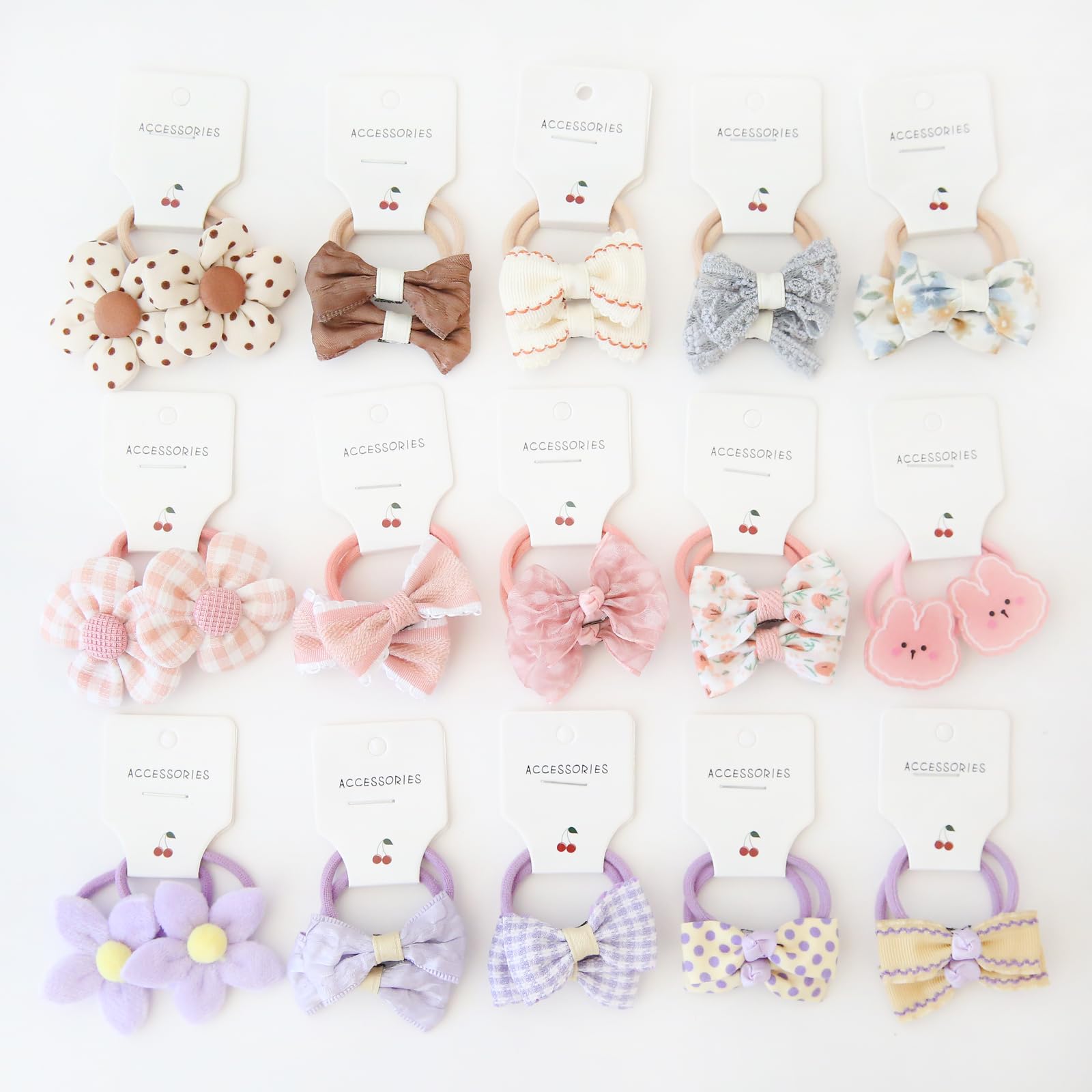 BOUNIQ baby hair ties with bows demonstrate durable elastic for secure toddler ponytails.