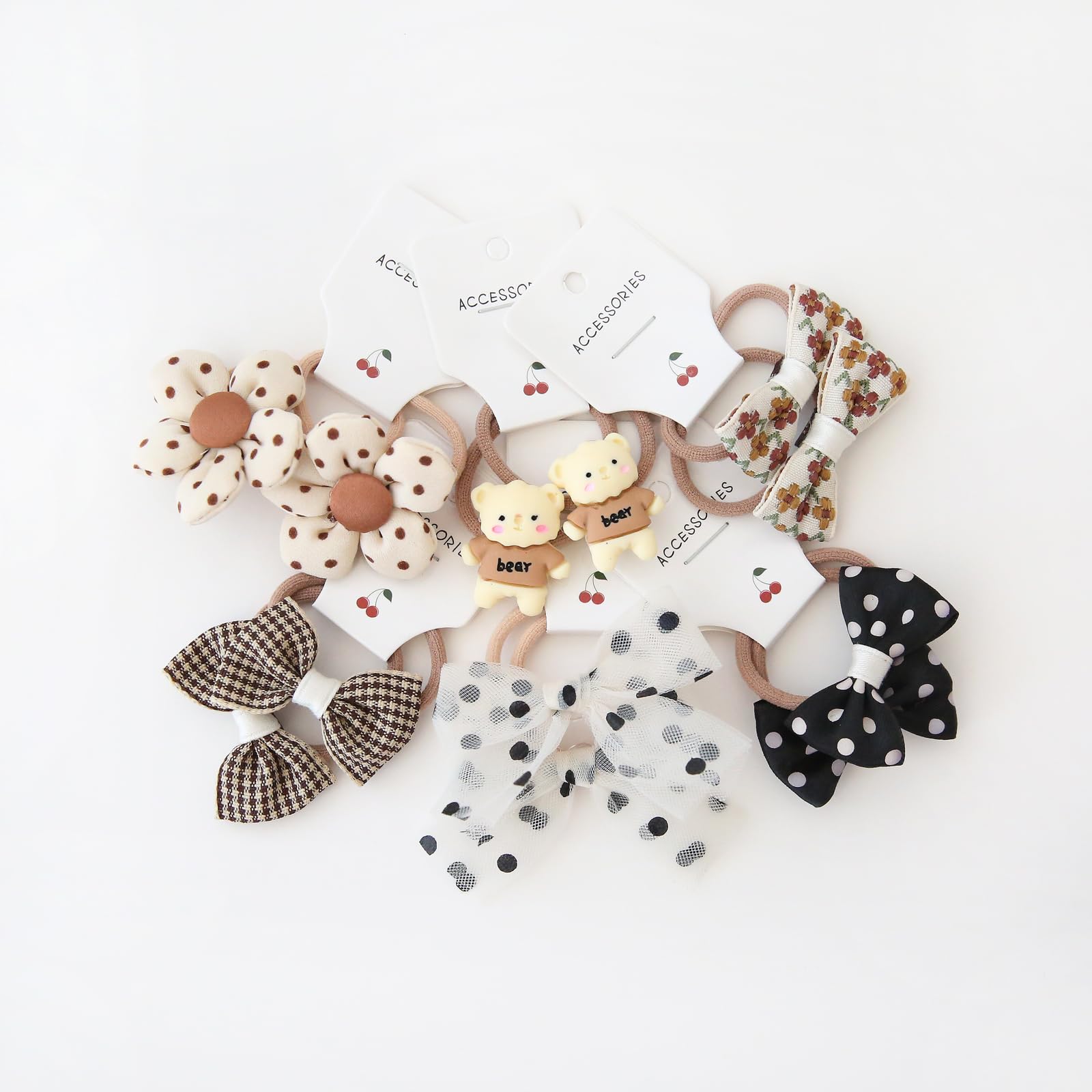 BOUNIQ toddler hair ties 1-2 inch elastics with 1.5 inch bows for gentle hold.