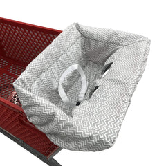 Brain Architect Child gray chevron cart cover in use on a grocery cart for a comfy ride.