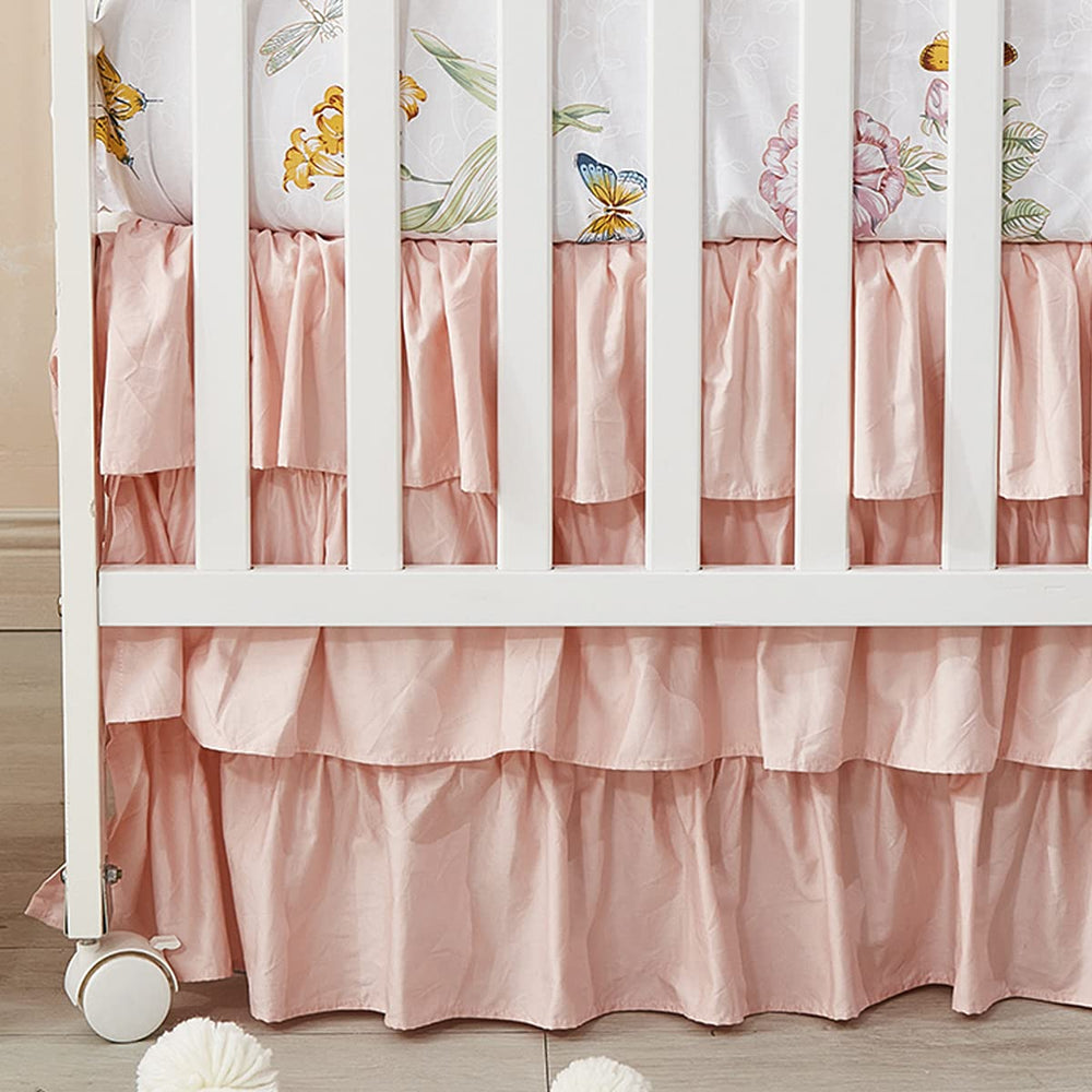 Brandream blush pink shabby chic crib skirt closeup showcasing soft 100% Egyptian cotton feel for a cozy nursery