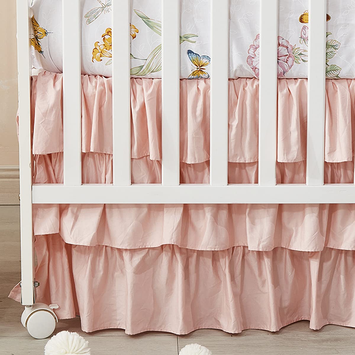 Brandream blush pink shabby chic crib skirt closeup showcasing soft 100% Egyptian cotton feel for a cozy nursery