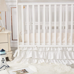 Brandream crib skirt with split corners for easy placement around posts.