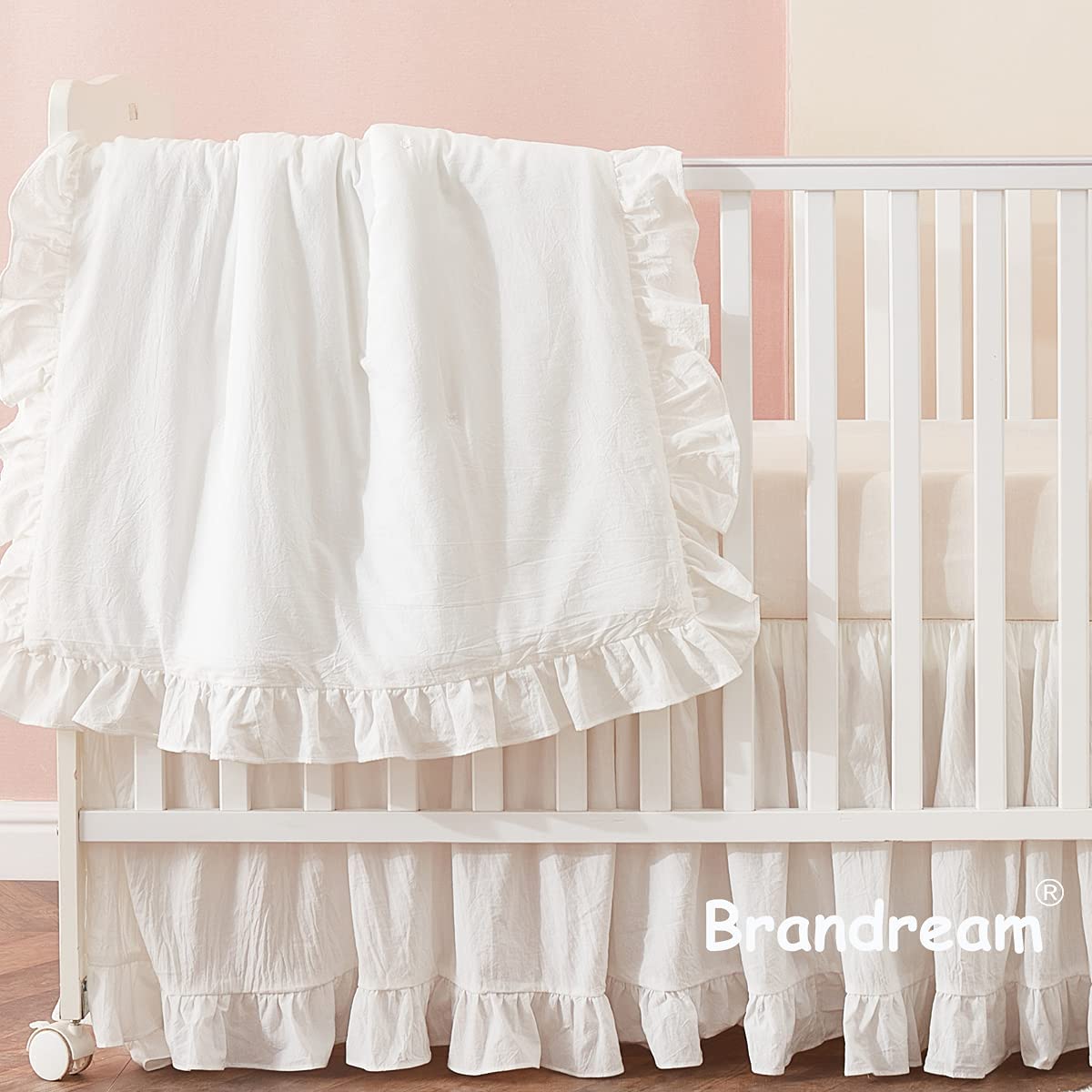 Brandream Farmhouse 3-piece set on crib demonstrates cohesive white design for versatile nursery.