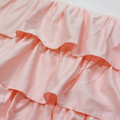 Brandream four-sided triple-layer crib skirt closeup highlighting secure fit around posts and easy placement