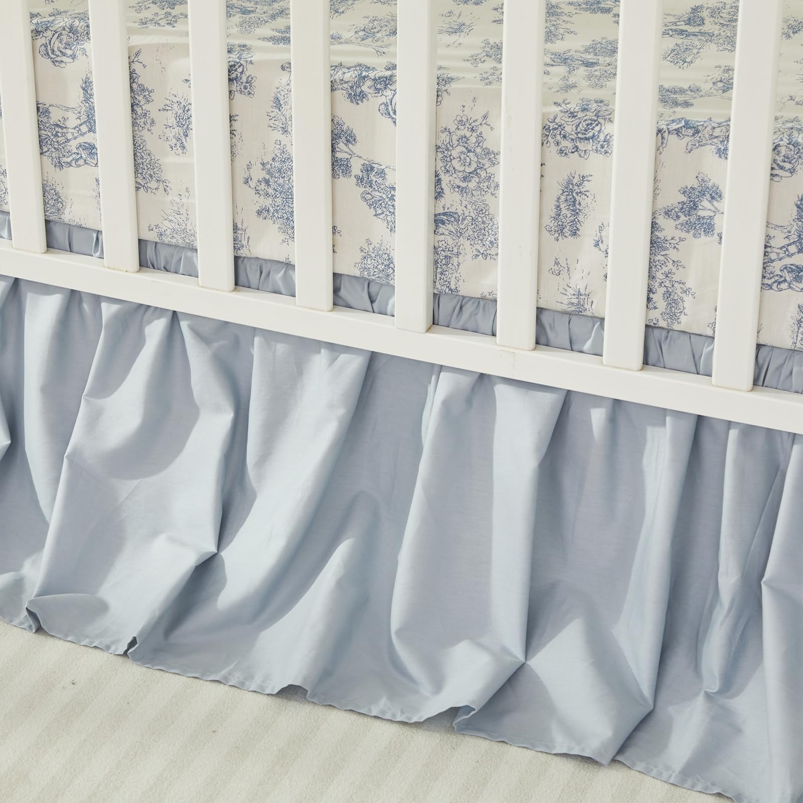 Brandream crib sheet on standard crib demonstrates secure elastic edge for snug fit.