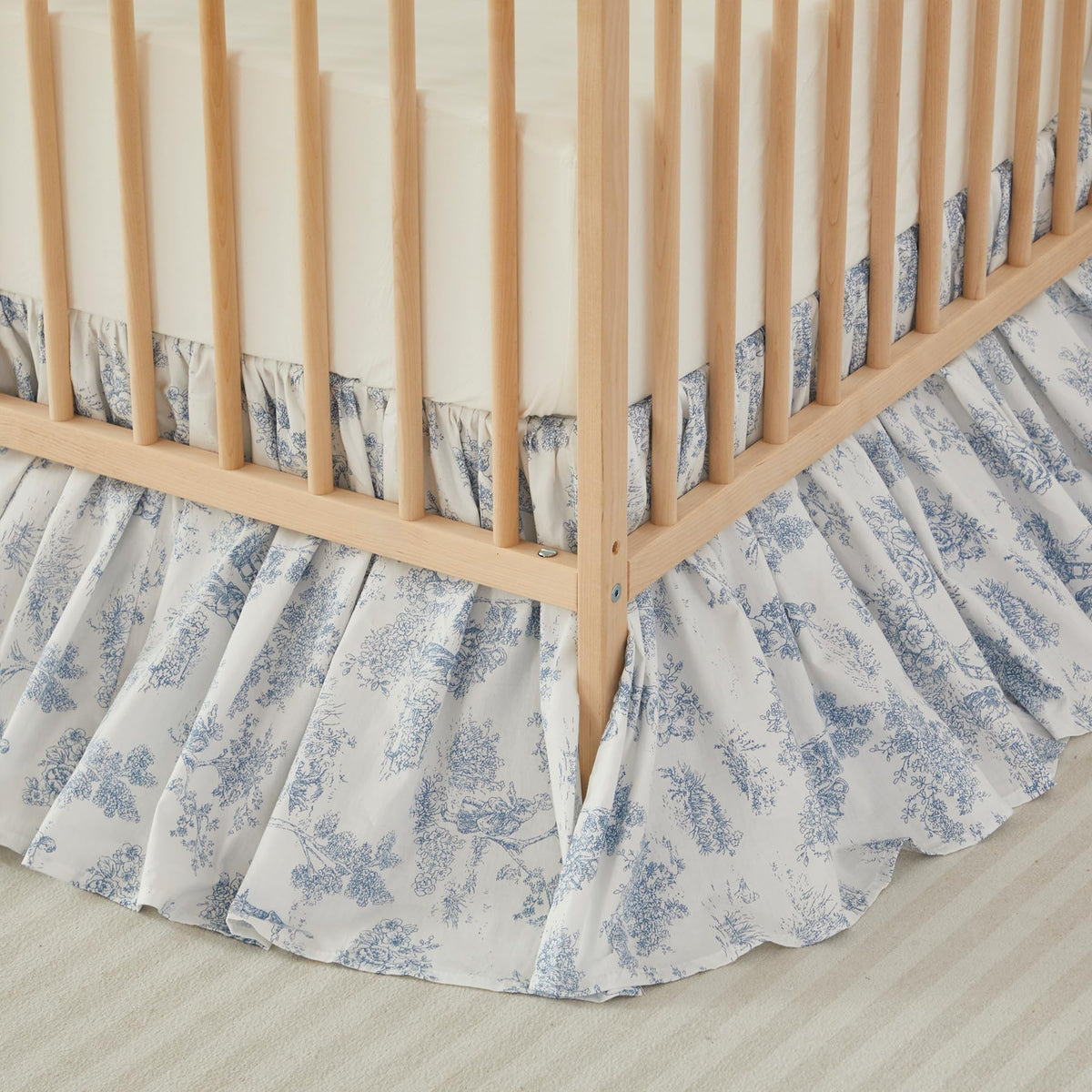Brandream French Country Toile crib skirt in blue ruffles enhances nursery charm.