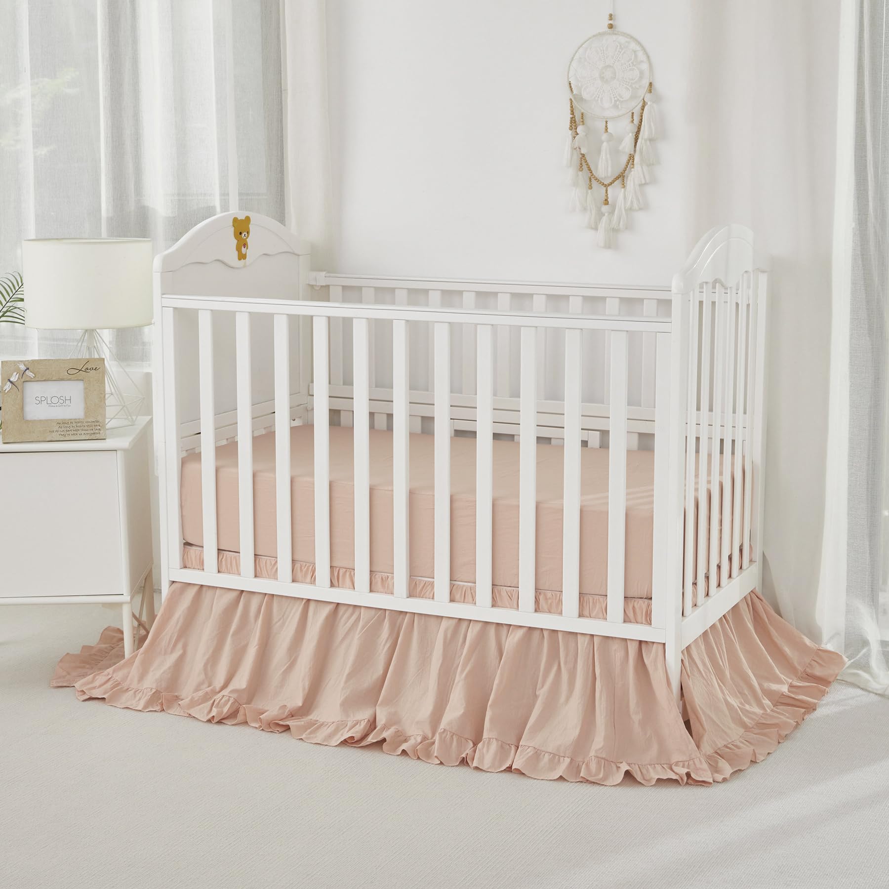 Brandream nursery setup in blush tones demonstrates versatile, calming decor for a crib space.