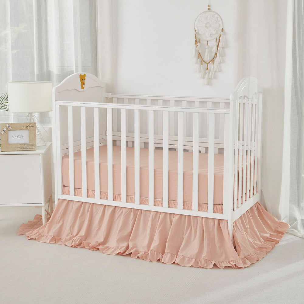 Brandream nursery setup in blush tones demonstrates versatile, calming decor for a crib space.