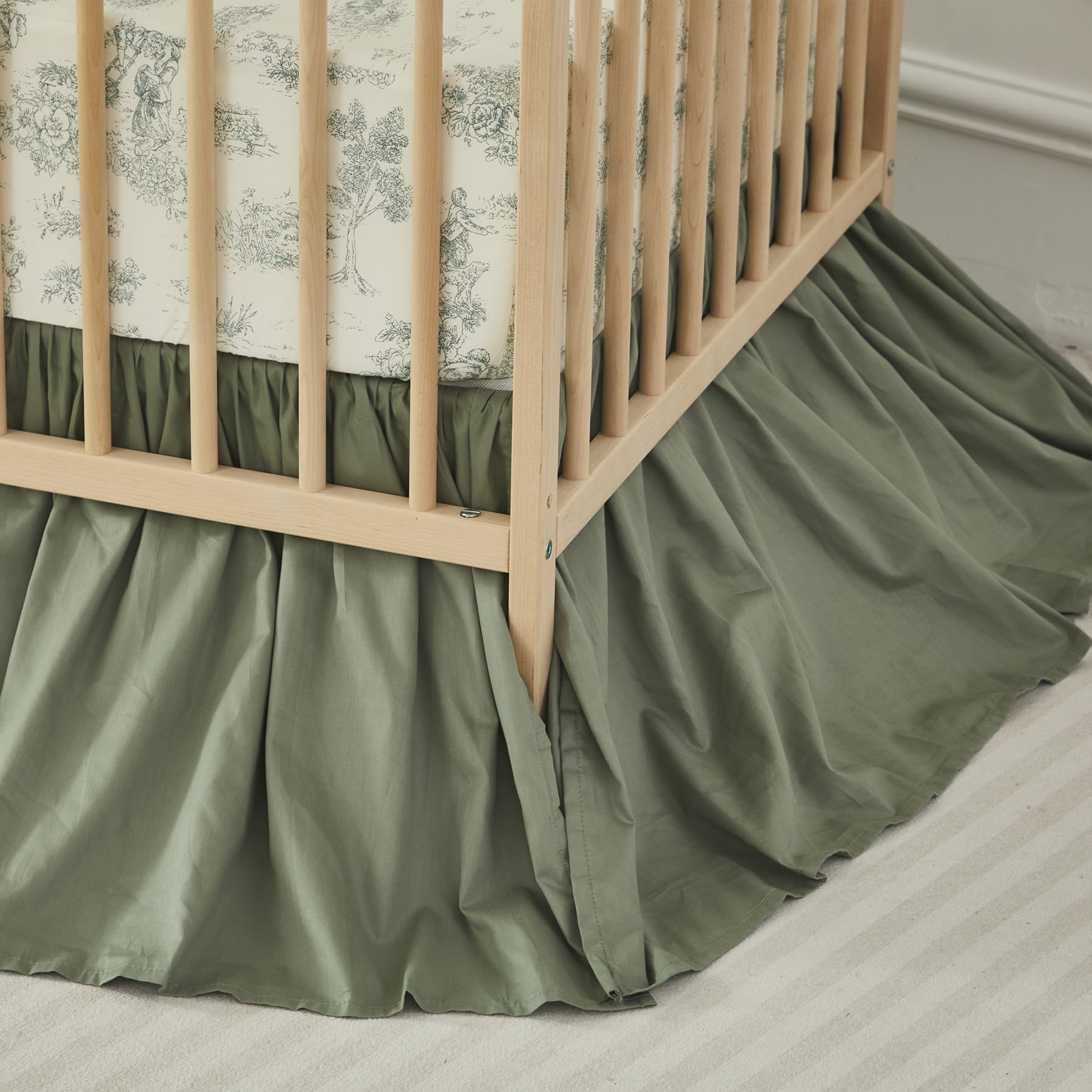 Brandream ruffles crib skirt closeup adds elegant, tailored finish to the nursery.