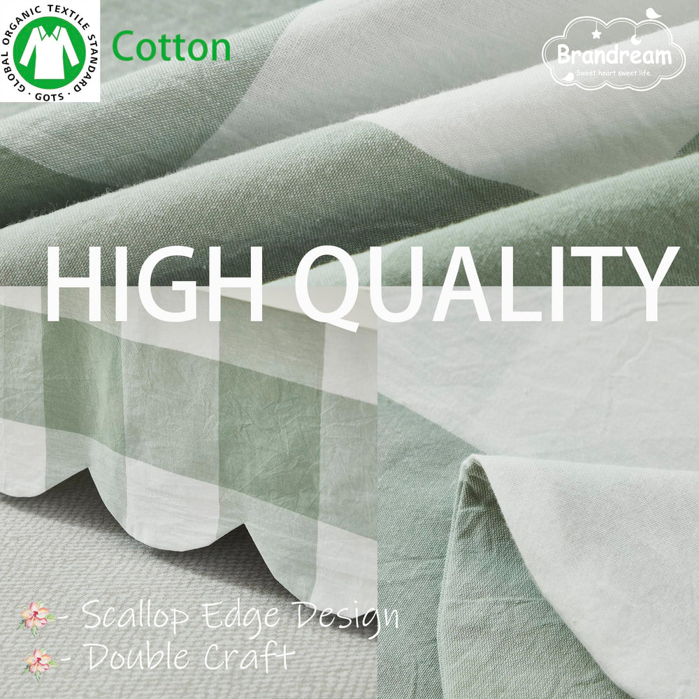 Brandream sage-green crib skirt coordinates with neutral decor and calming vibes.