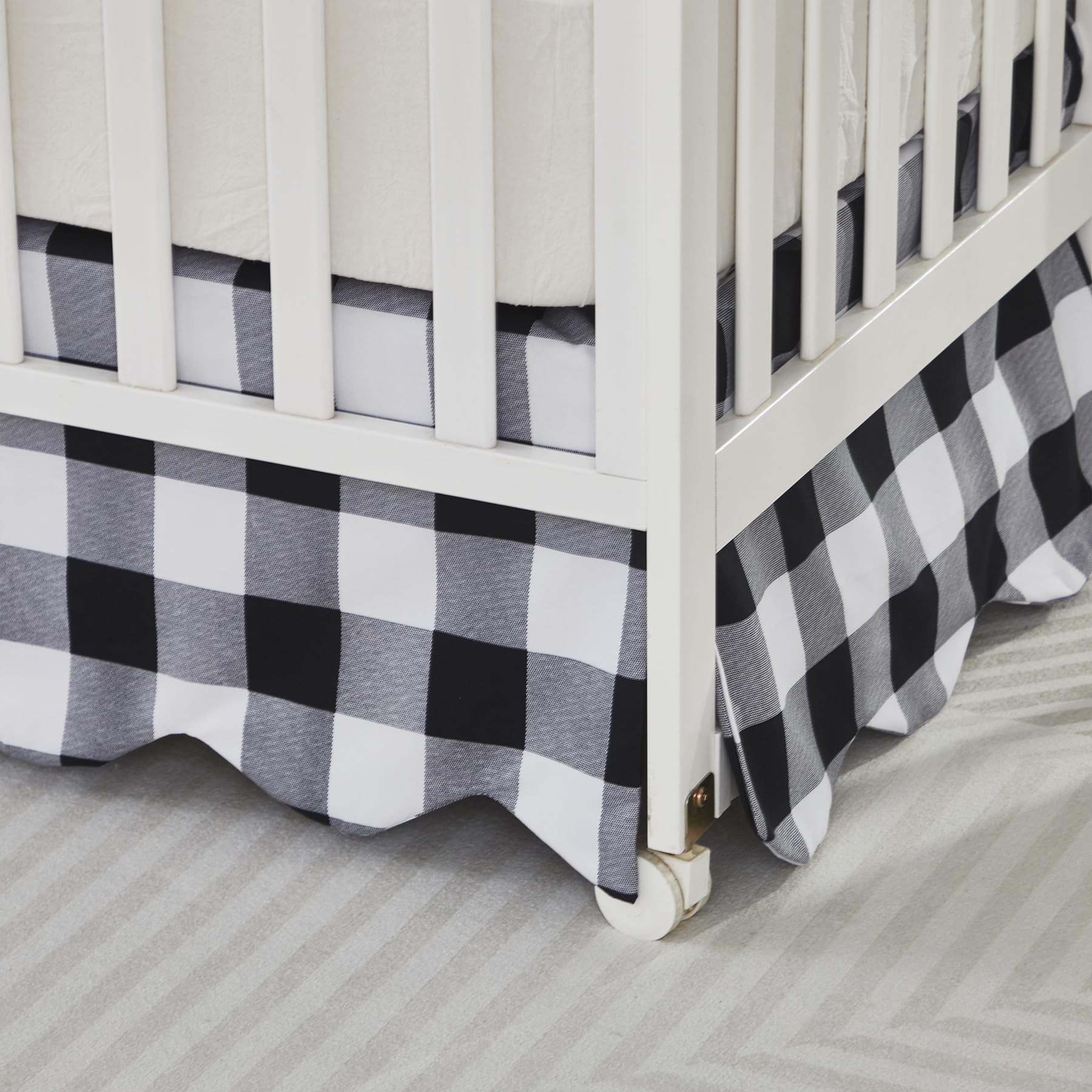 Brandream Scallop Edge Crib Skirt in black-white gingham coordinates with modern nursery decor