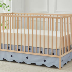 Brandream scallop edge crib skirt closeup emphasizes dotted pattern for chic nursery decor.