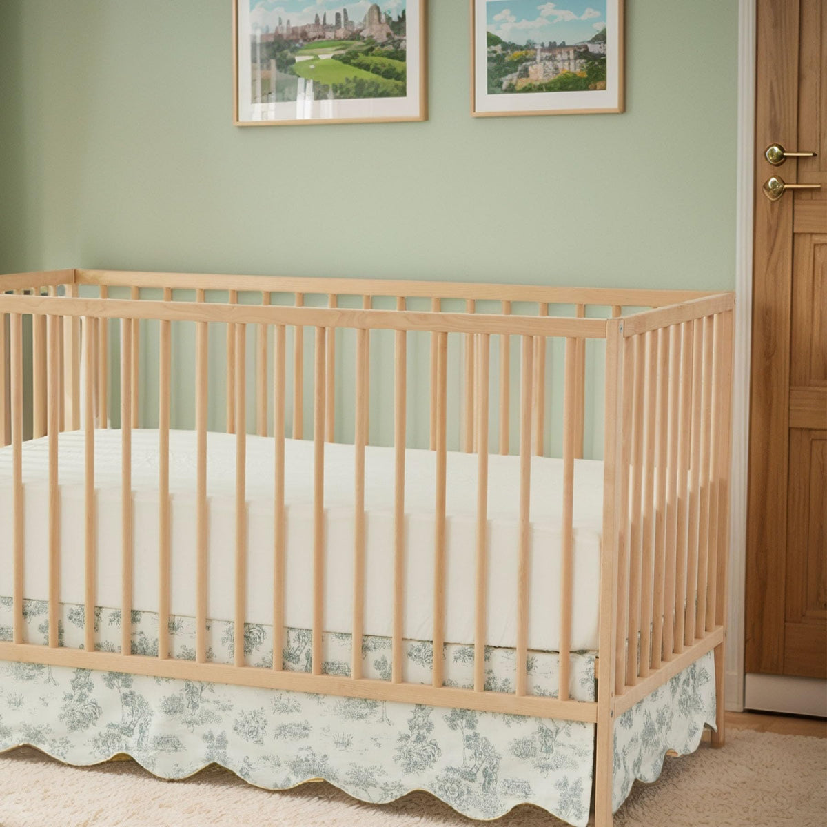 Brandream scallop edge crib skirt in green toile print adds vintage charm.