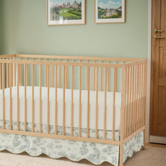 Brandream scallop edge crib skirt in green toile print adds vintage charm.
