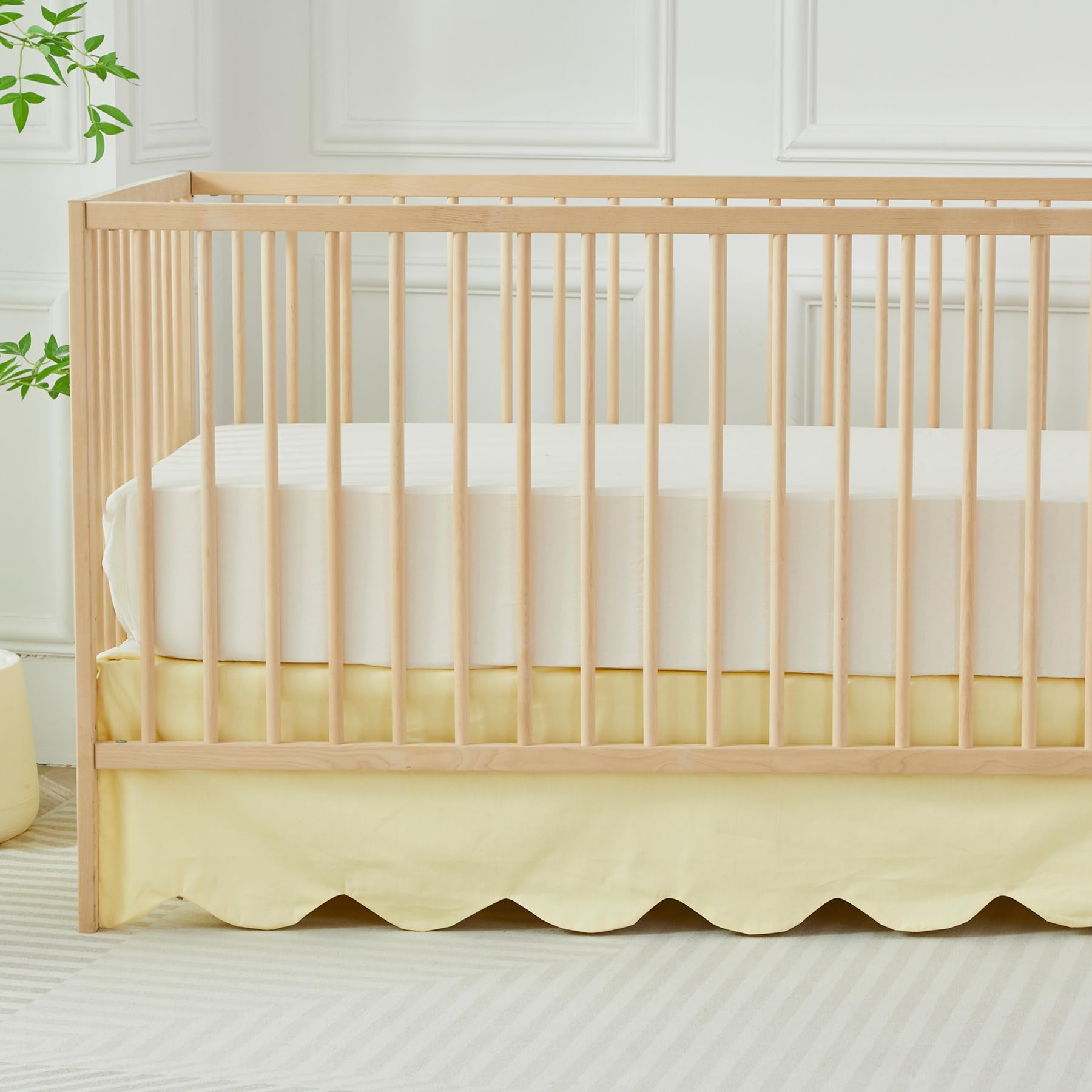 Brandream scallop edge crib skirt in light yellow adds soft, stylish nursery charm.
