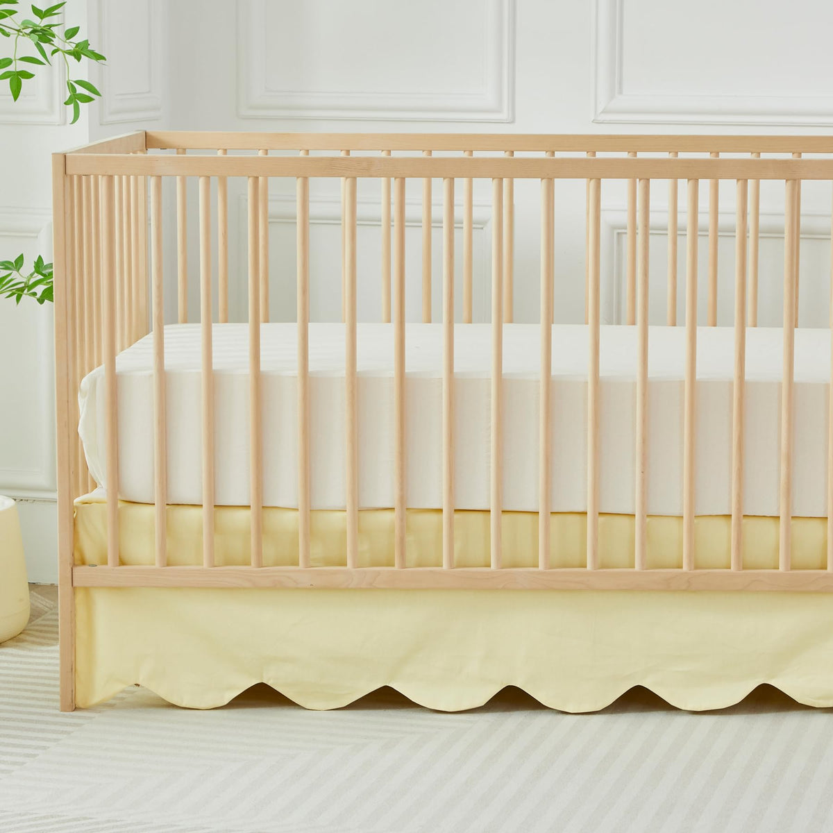 Brandream scallop edge crib skirt in light yellow adds soft, stylish nursery charm.