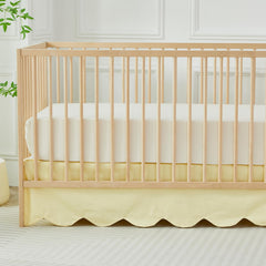 Brandream scallop edge crib skirt in light yellow adds soft, stylish nursery charm.